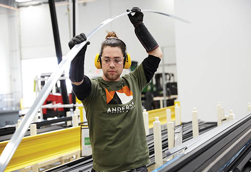 andersen employee working with fibrex window material