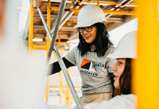 andersen employees with hardhats working on home