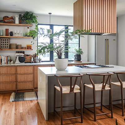 Hilton Carter after image of kitchen with natural wood and modern black details