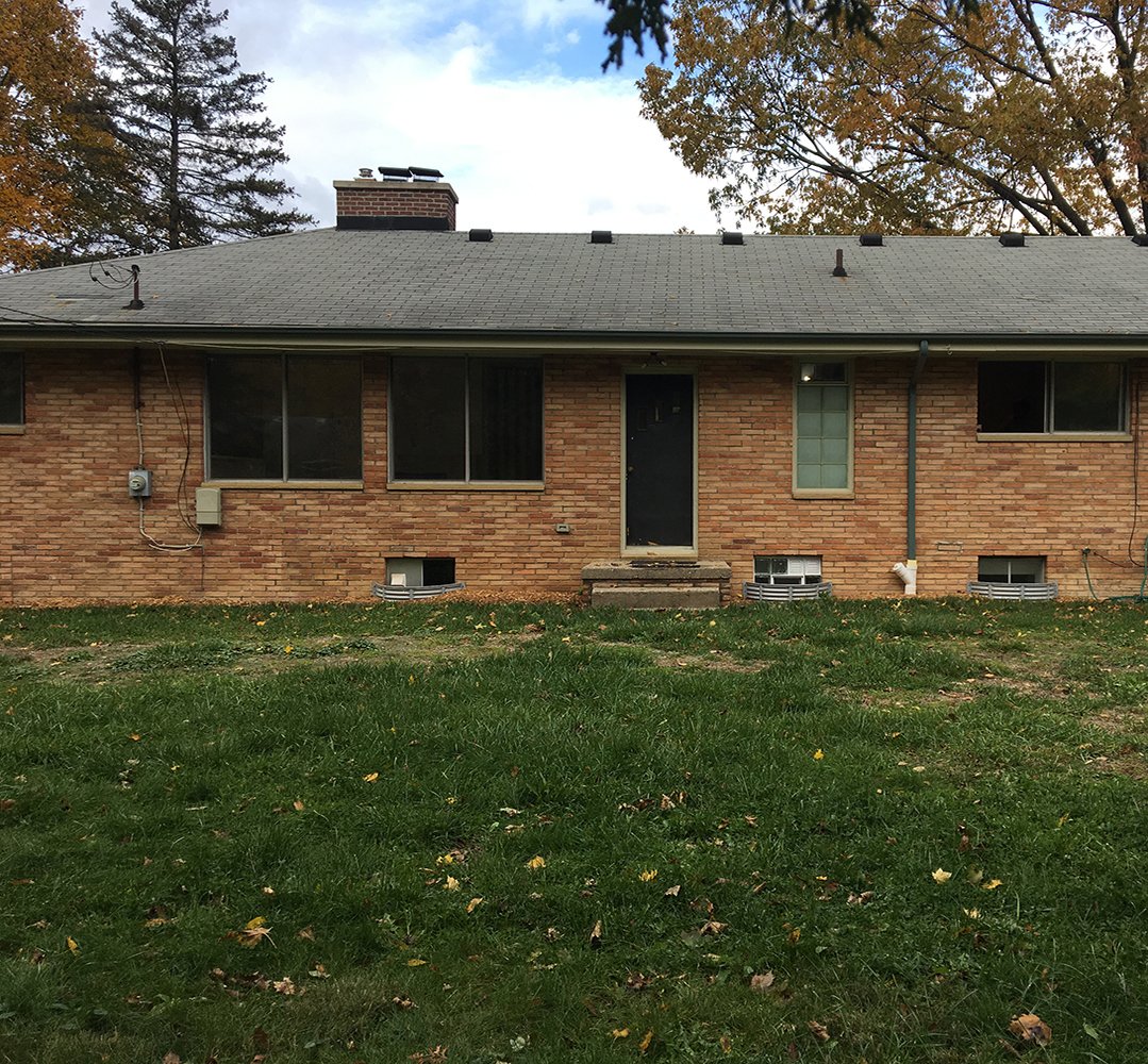 brick ranch style home with no porch