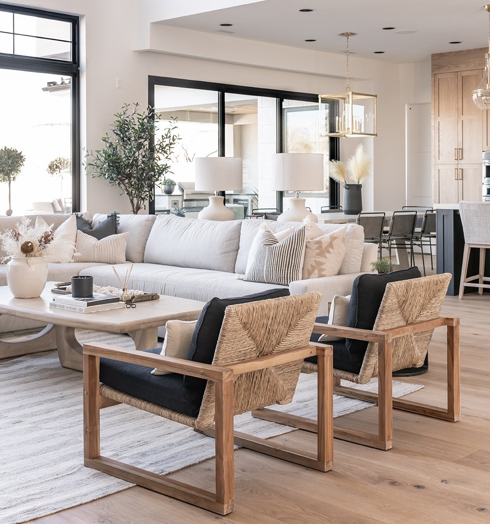 Living room interior with an Andersen Aluminum Mulit-Slide Door in the background in black.