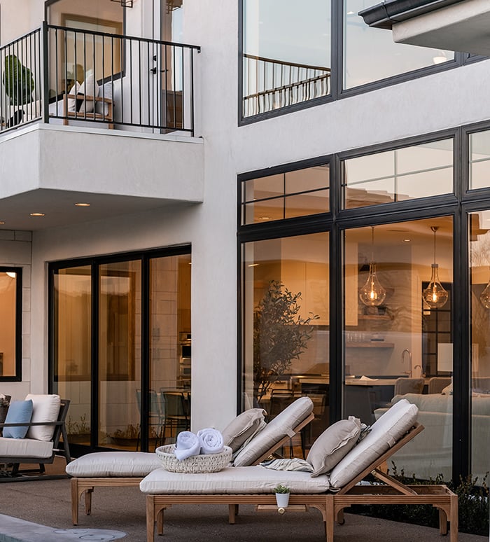 Extra-large black windows give a glimpse inside this contemporary luxury home in Utah. 