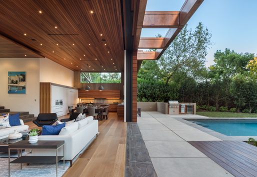 Indoor/outdoor living with wide opening leading to pool