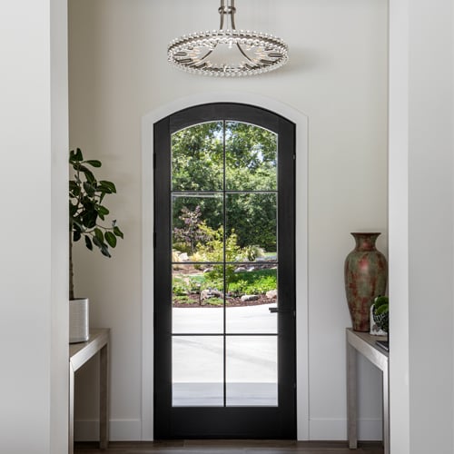 Black interior arched top door with grilles. 