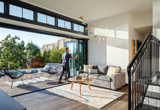 Folding Outswing door and E-Series hinged patio doors and windows in aquamarine. Architecture by Asquared Studios