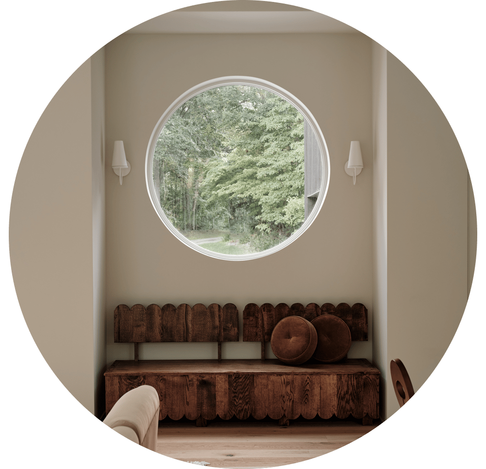 Circle window in a cozy nook with a unique bench seat