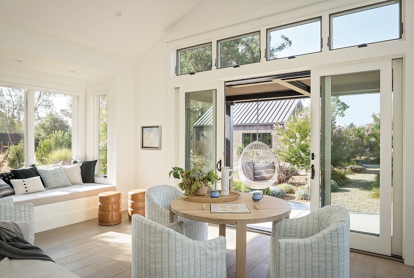 A living room with sliding glass doors and transom windows above.