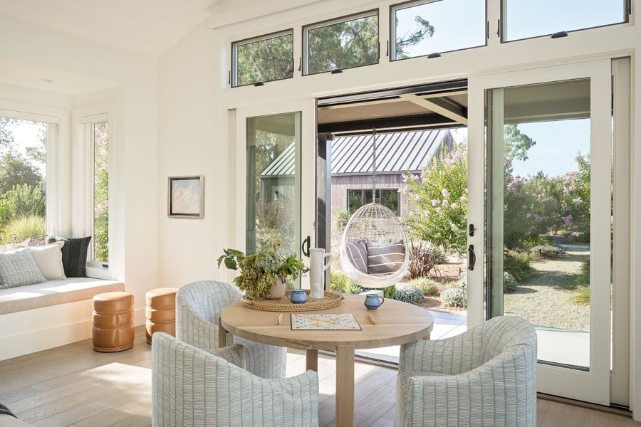 A living room with sliding glass doors and transom windows above.