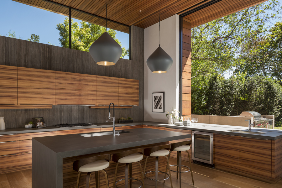 Modern kitchen with large Liftslide pass-through window going outdoors