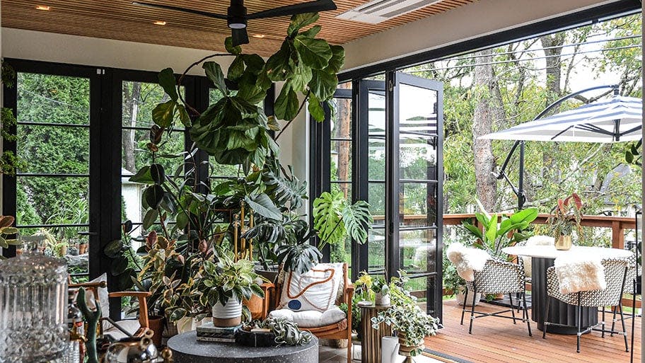 Hilton Carter’s sunroom features a Folding Outswing door connecting to a deck 