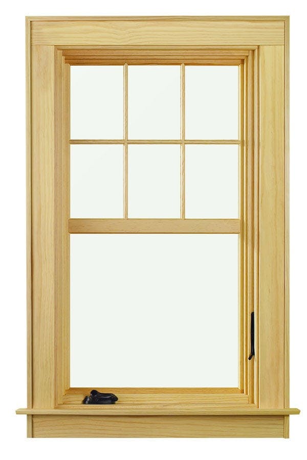 A pine casement window with black hardware and grilles applied in such a way to make the window look like it is double hung.